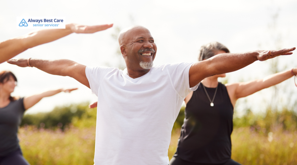 Older adults stretching their arms during an outdoor fitness class.