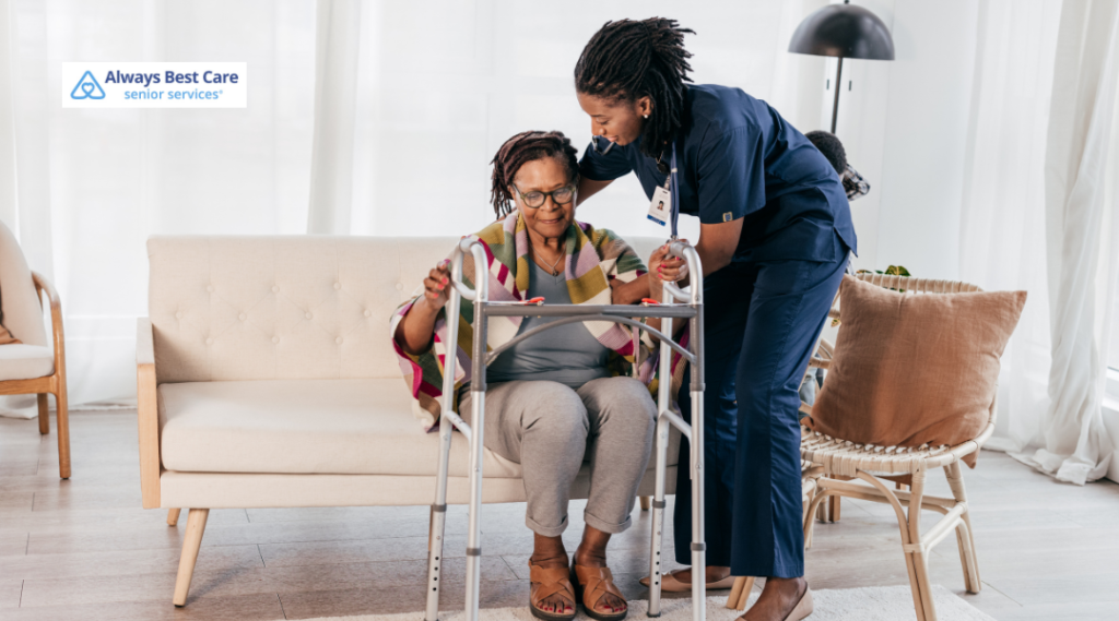 7. Caregiver helping an older woman prepare to stand with a walker.
