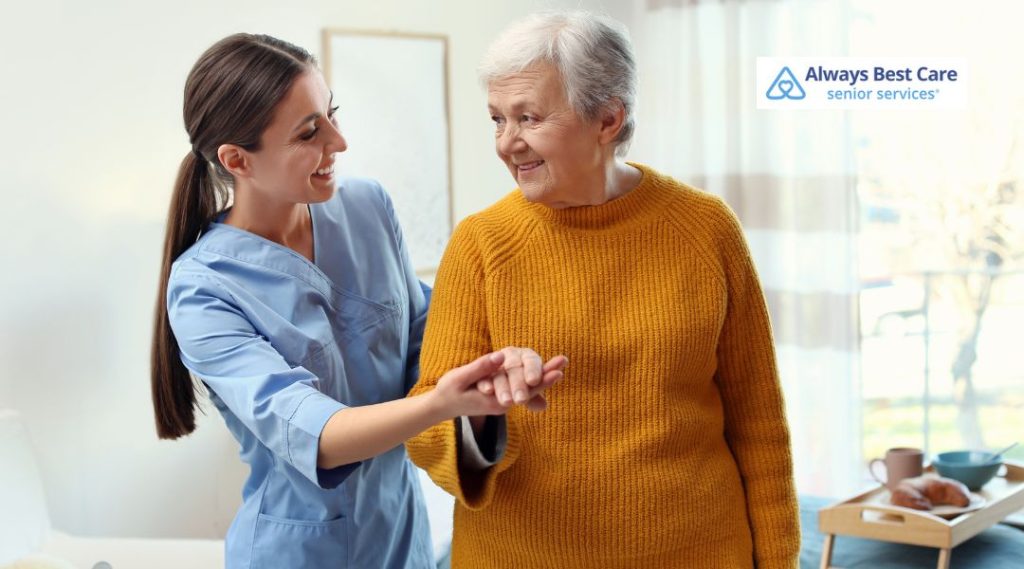 Senior caregiver assisting an elderly man with cognitive therapy and memory support activities.
