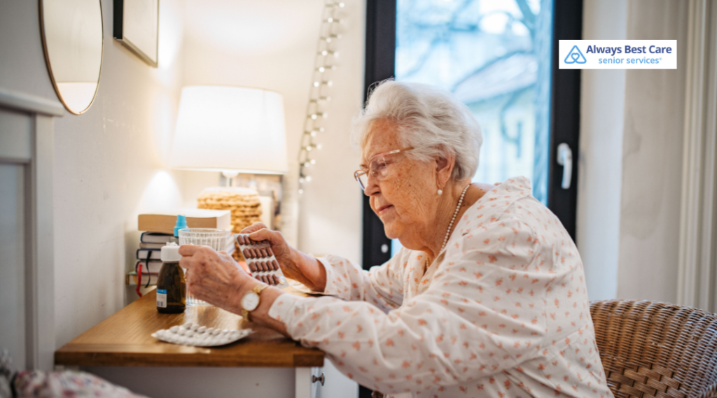 Older woman organizing medications at a bedside table.