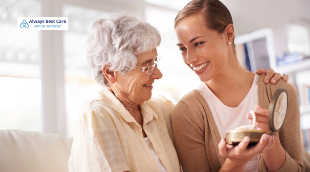 A compassionate caregiver sharing a special moment with an elderly woman, highlighting the personal connection in memory care.