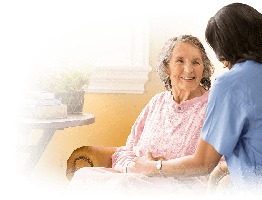SENIOR WOMAN SMILING WITH A CAREGIVER