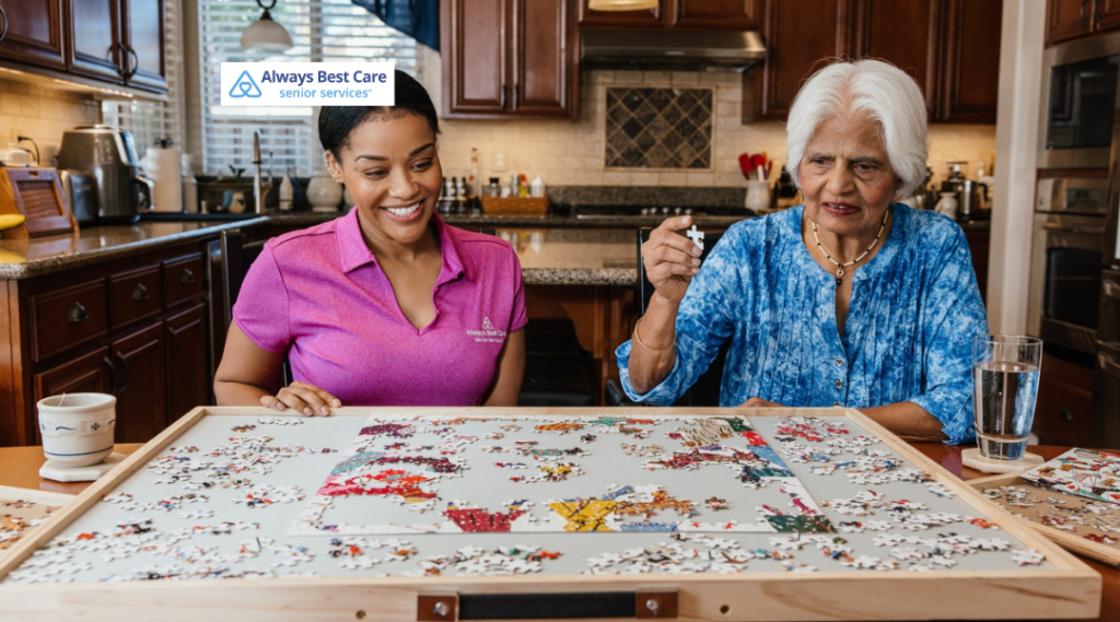 Caregiver standing beside an older adult at a dining table, serving a plate with a balanced meal, emphasizing nutrition support and mealtime assistance at home.

