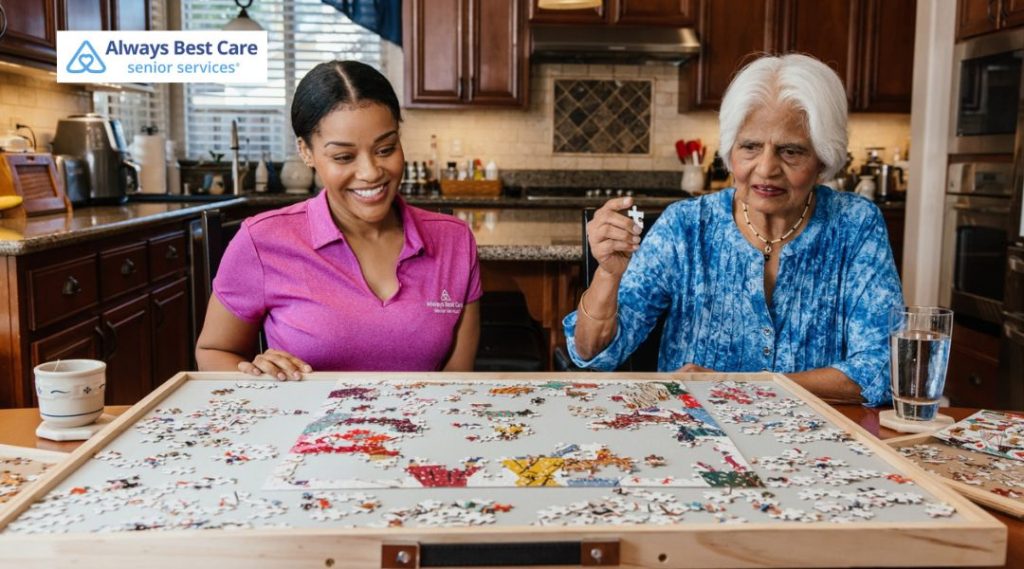 Professional caregiver completing a jigsaw puzzle with a senior woman as part of memory care activities.