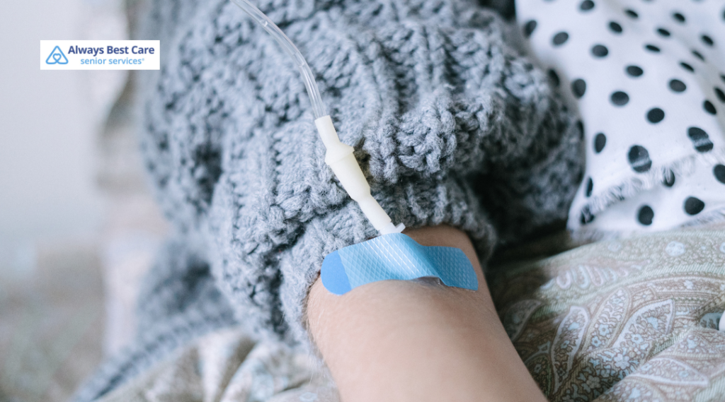 Close-up of an intravenous line secured to a patient’s arm.