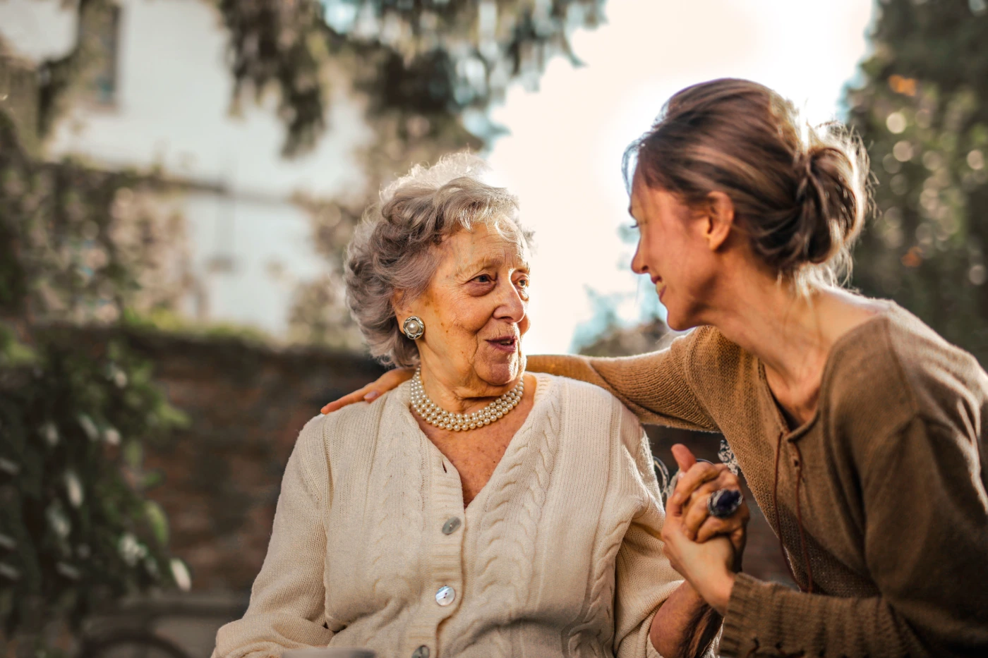 Senior woman smiling with a professional caregiver in a Kingwood home