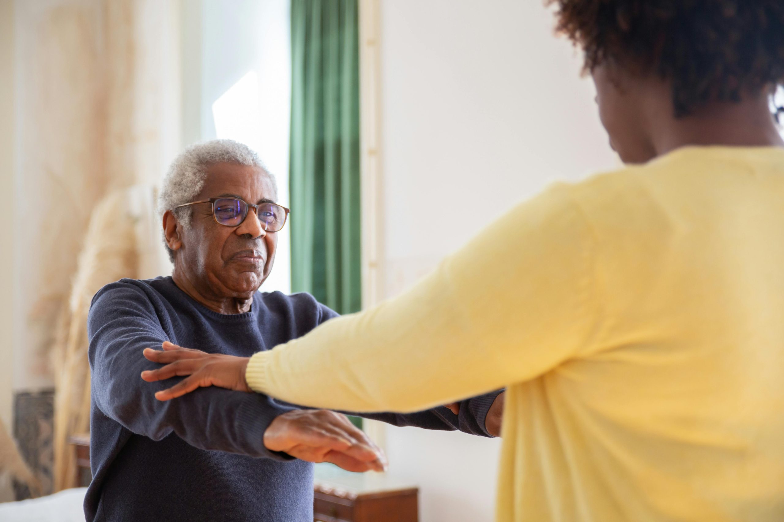 a woman giving a home care assistance to an old man in Maryville, TN