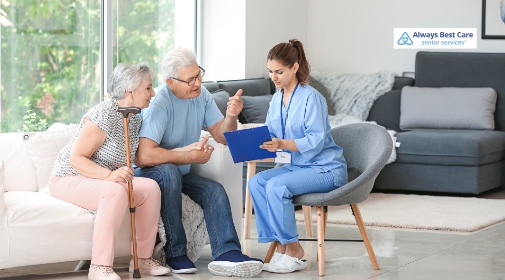  A caregiver discussing care options with an elderly couple, providing them with personalized support and guidance in a home setting.