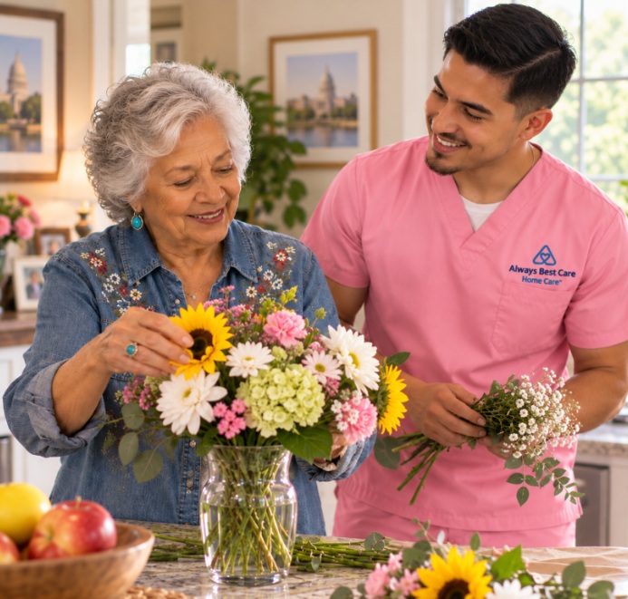 Caregiver arranging flowers with an older woman in Madison, WI.