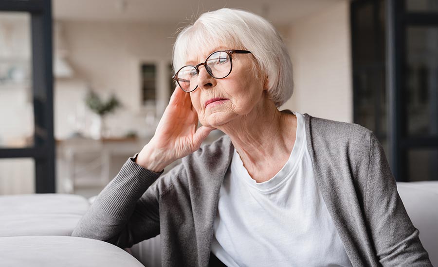 A senior looking into the distance