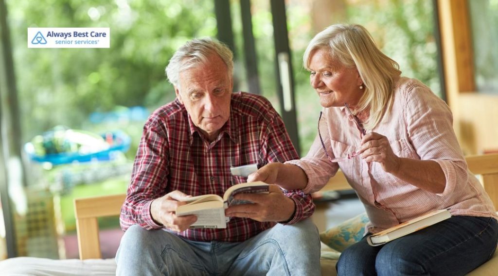 A senior man and senior woman reading a book