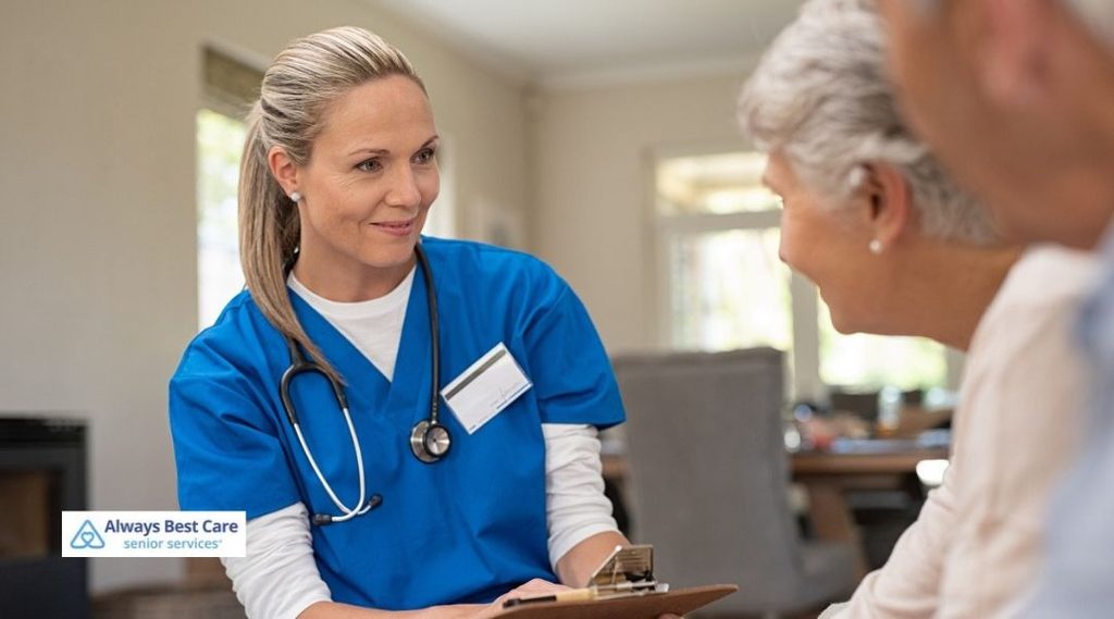 Skilled nurse reviewing a care plan with an older woman using a wheelchair at home.