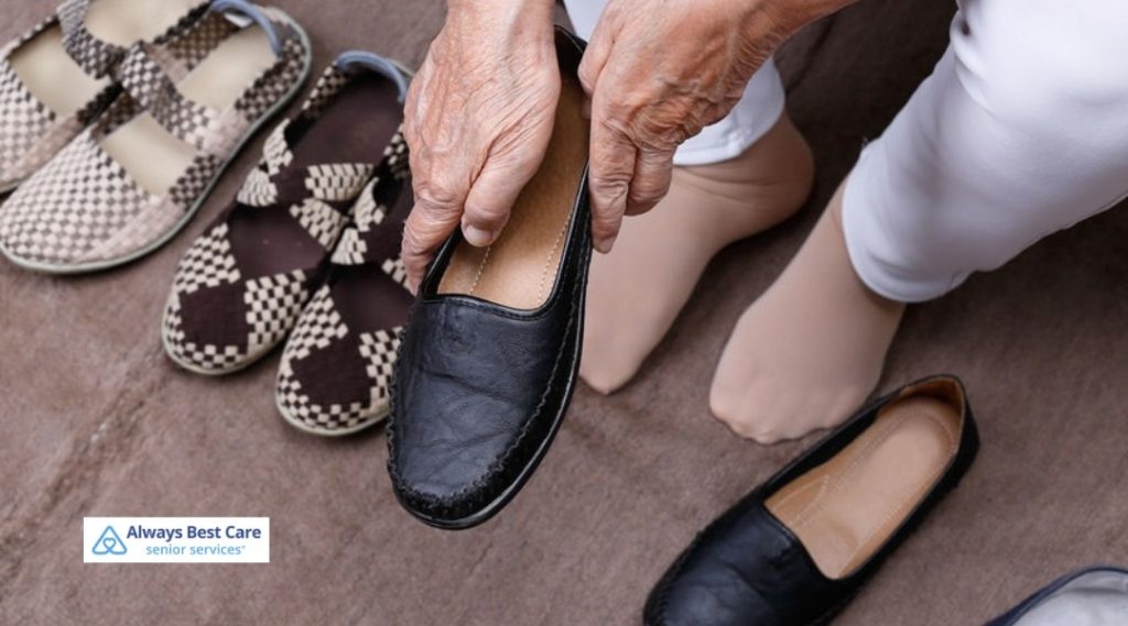Senior woman choosing between different comfortable shoes, emphasizing the role of proper footwear in foot health.