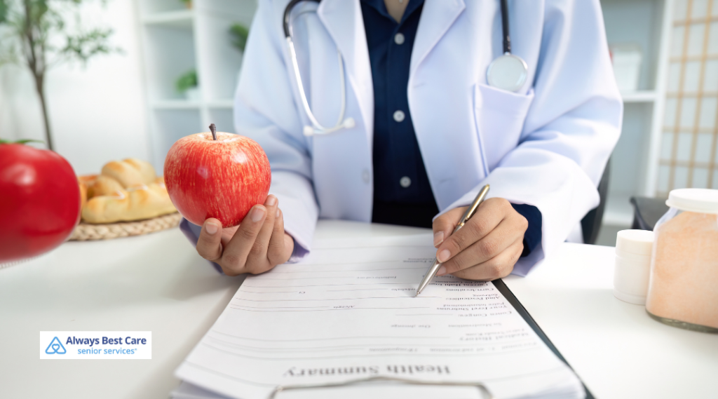 3. HEALTHCARE PROFESSIONAL HOLDING AN APPLE AND REVIEWING A NUTRITION PLAN TO SUPPORT HEALTHY EATING HABITS.