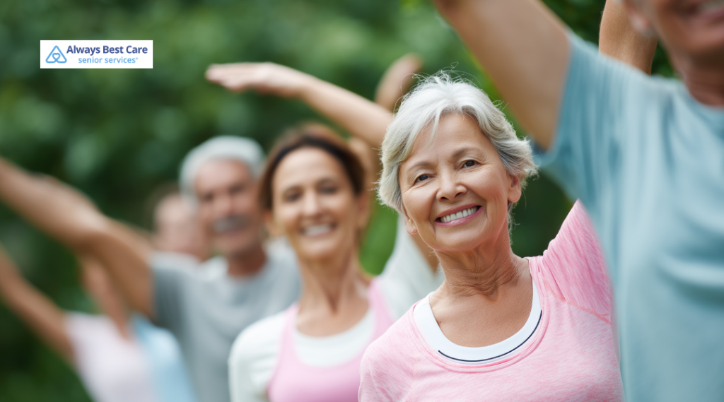 4. GROUP OF ACTIVE SENIORS EXERCISING OUTDOORS, RAISING THEIR ARMS DURING A GENTLE FITNESS CLASS.