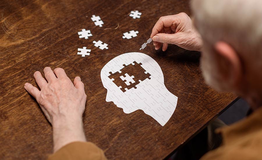 A dementia patient completing a puzzle​
