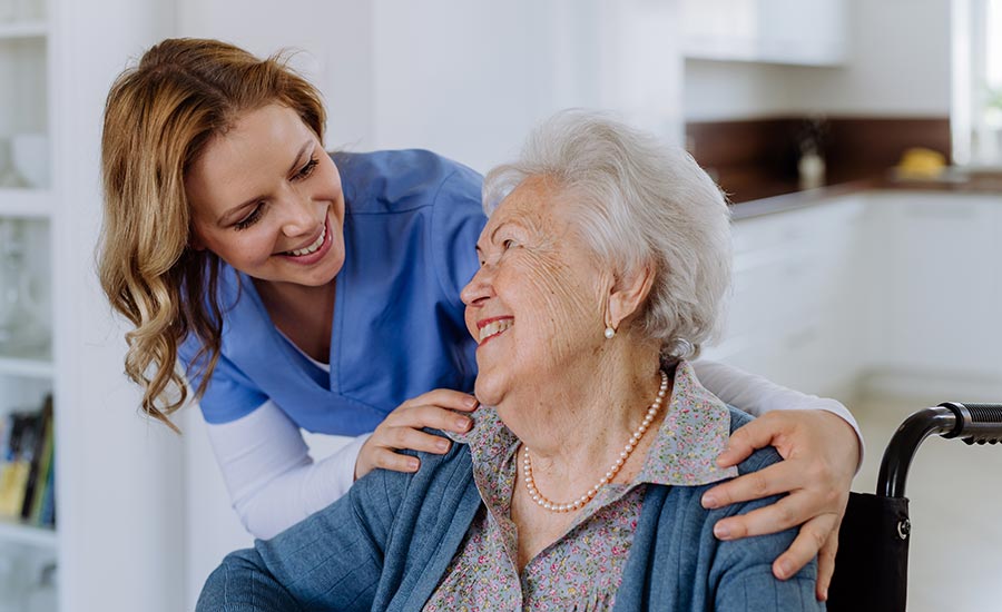 A caregiver comforting a dementia patient​