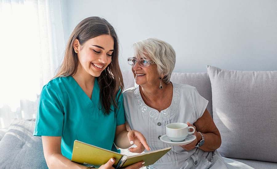 A caregiver laughing with a senior