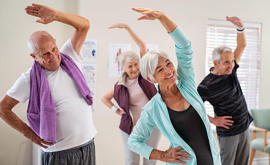 A group of elderly patients exercising​