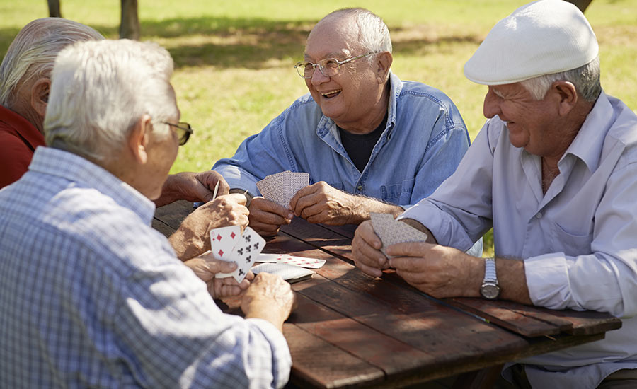 A group of seniors playing cards​