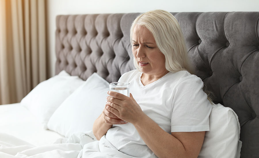 A senior woman staying in bed​