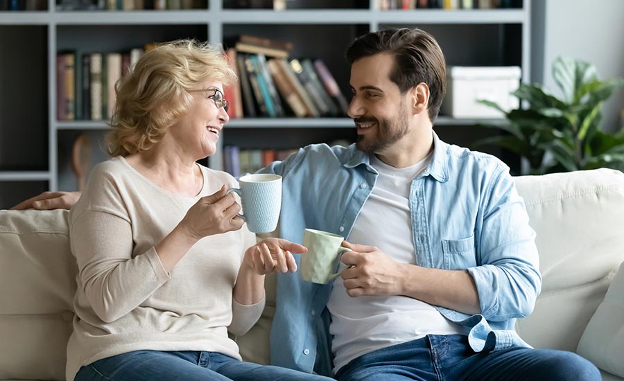 A mother and son bonding over a cup of coffee​