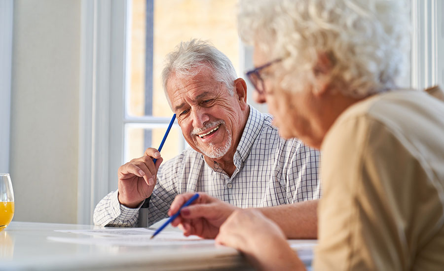 An elderly couple enjoying a fun activity