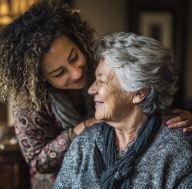 Caregiver comforting senior woman with compassionate support at home in Madison, WI.